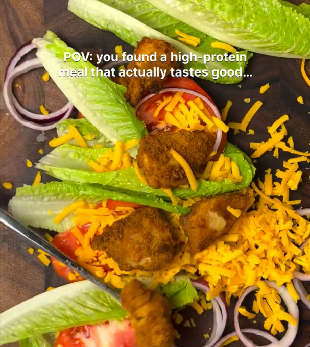 Step 1.1: Combine romaine, tomatoes, cheddar, red onion, and the chicken on a cutting board