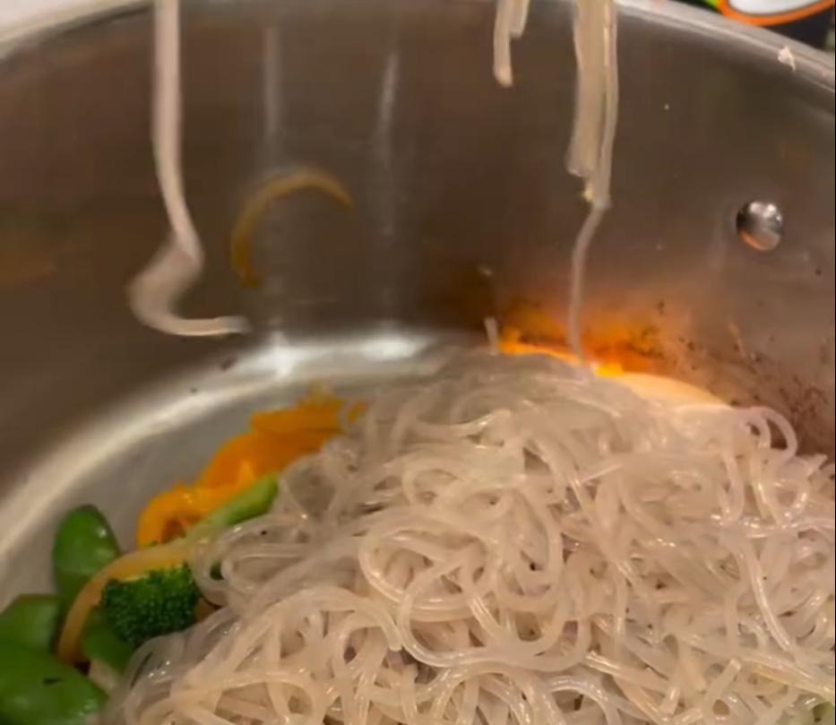 Step 2.1: Add marinated glass noodles to the pot