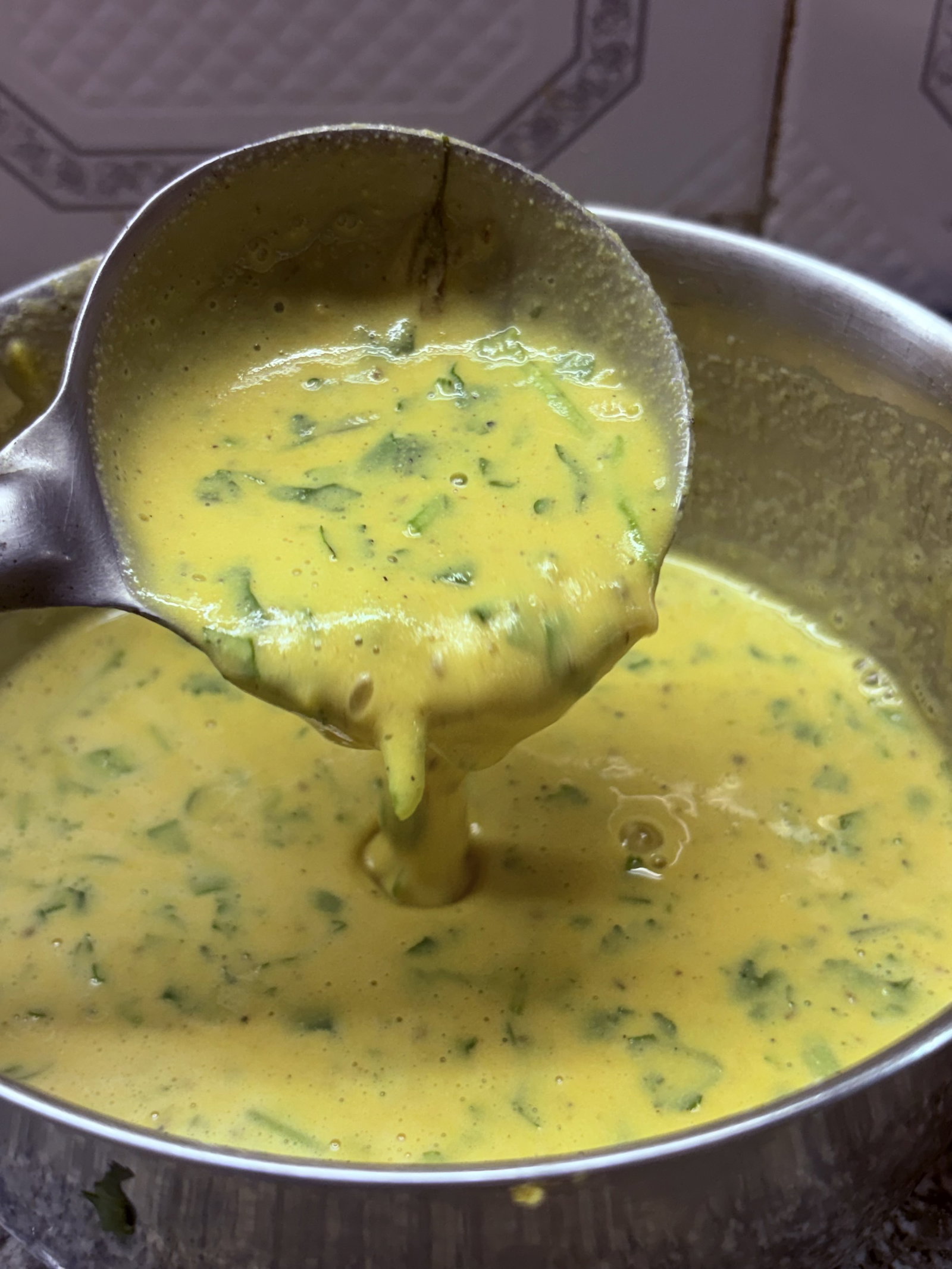 Step 1.1: Gradually add water while whisking to form a smooth, lump-free batter