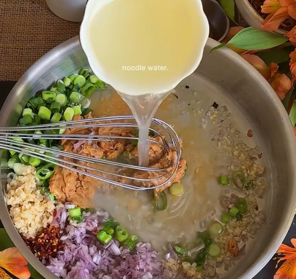 Step 2.1: Add noodle water, soy sauce, chilli oil, salt, sugar, and mix thoroughly