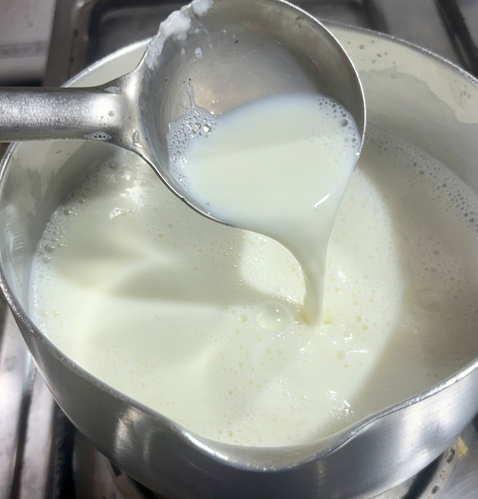 Step 1.1: Boil the full-fat milk in a heavy-bottomed pan over medium heat
