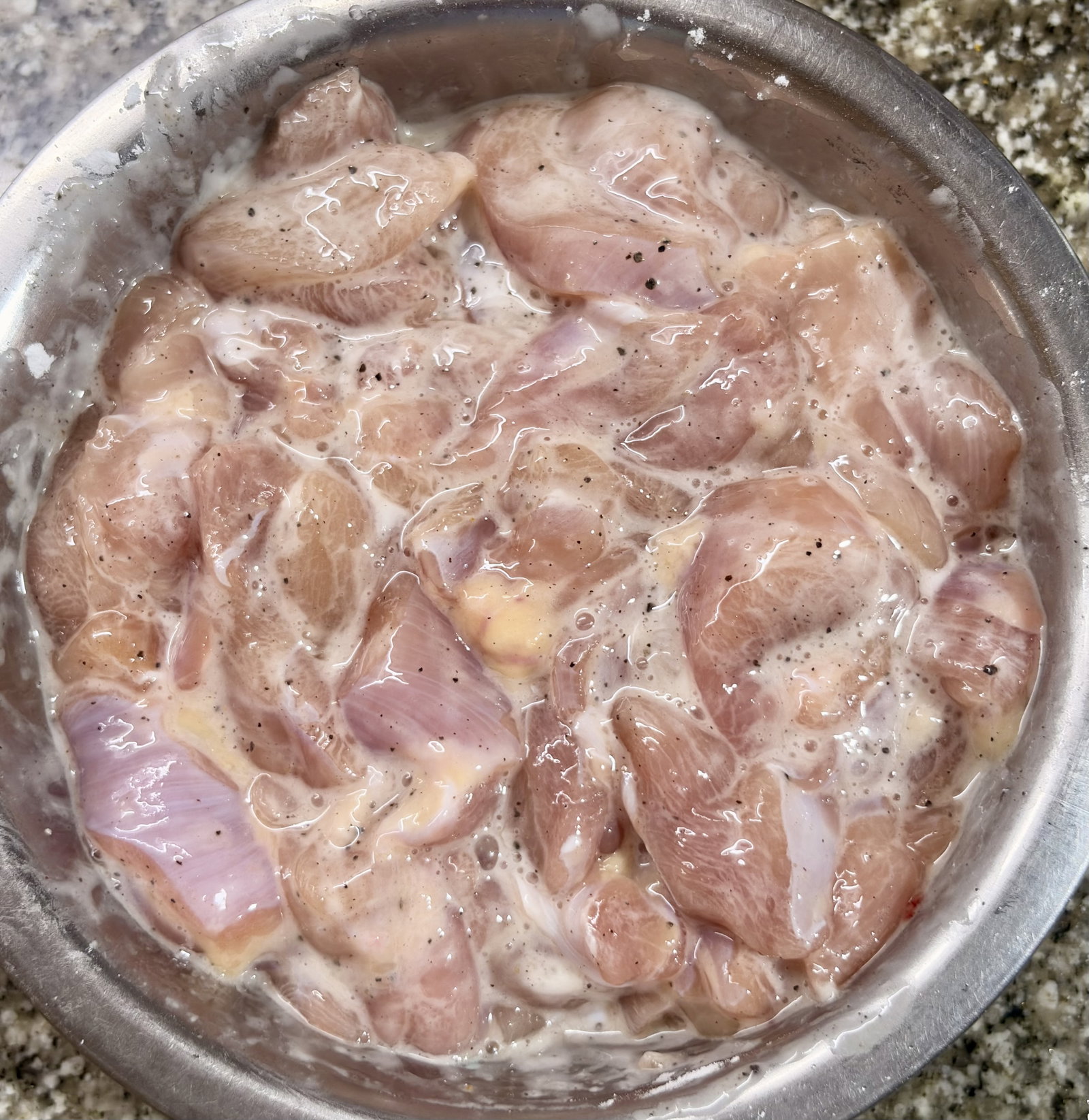 Step 1.1: Mix the chicken strips with salt, black pepper, egg white, and cornflour in a bowl until well coated