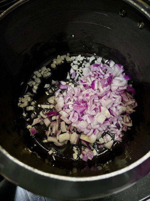 Step 1.1: Add garlic and onions and sauté until soft and lightly pink
