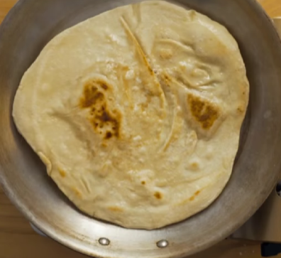 Step 1.1: Cook in a hot dry pan for 1–2 minutes per side until puffed and lightly golden