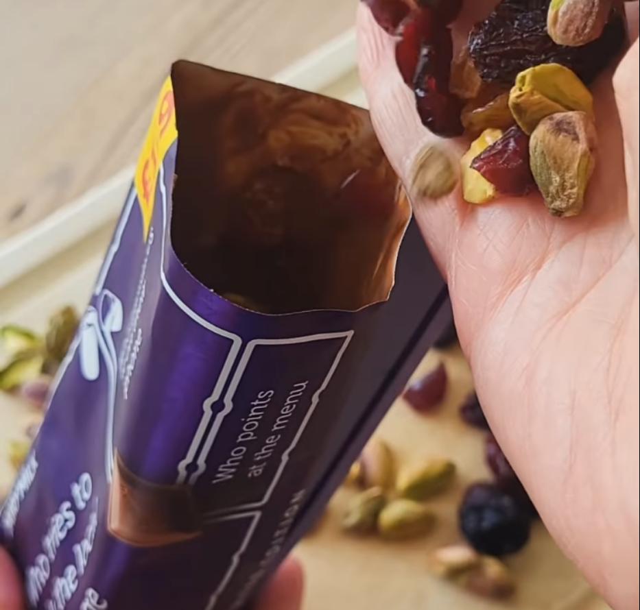Step 1.1: Cut open the top and fill with dried fruit and nuts (raisins, dried cranberries and pistachios)