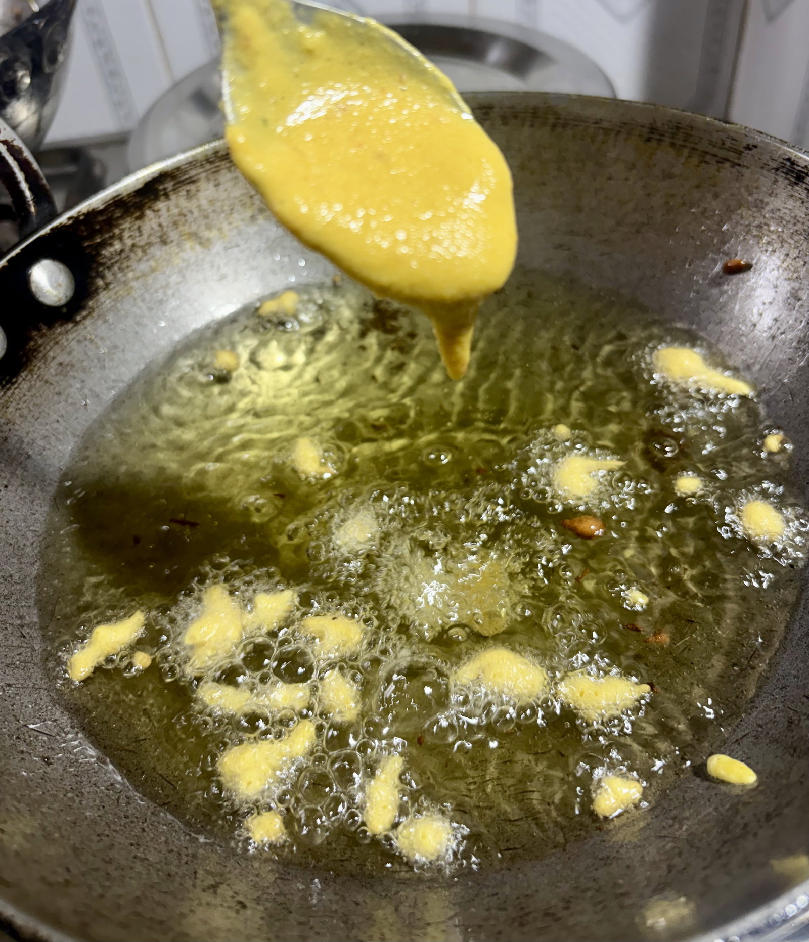 Step 3.1: Using leftover batter, drip small spoonfuls into the oil to form tiny drops