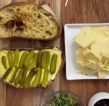 Step 1.1: Thinly slice the cornichon pickles and arrange them evenly on the toast