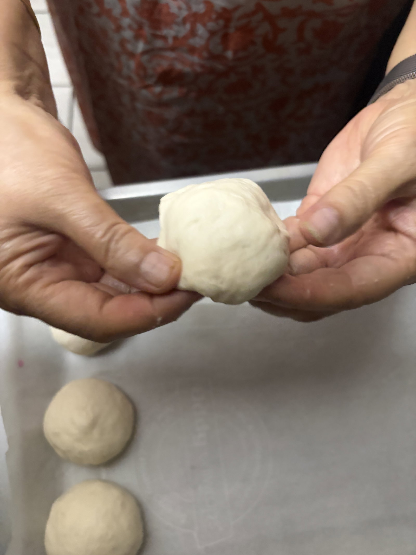 Step 4.1: Divide the dough into 6-8 equal portions and roll into smooth, crack-free balls
