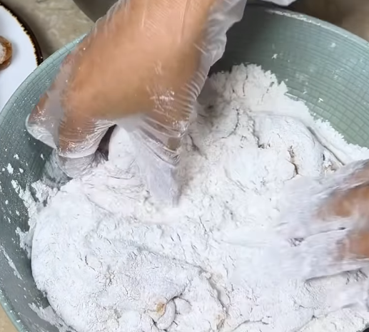 Step 2.1: Dip briefly into ice cold water, then press back into the dry coat again to create craggy, crispy layers