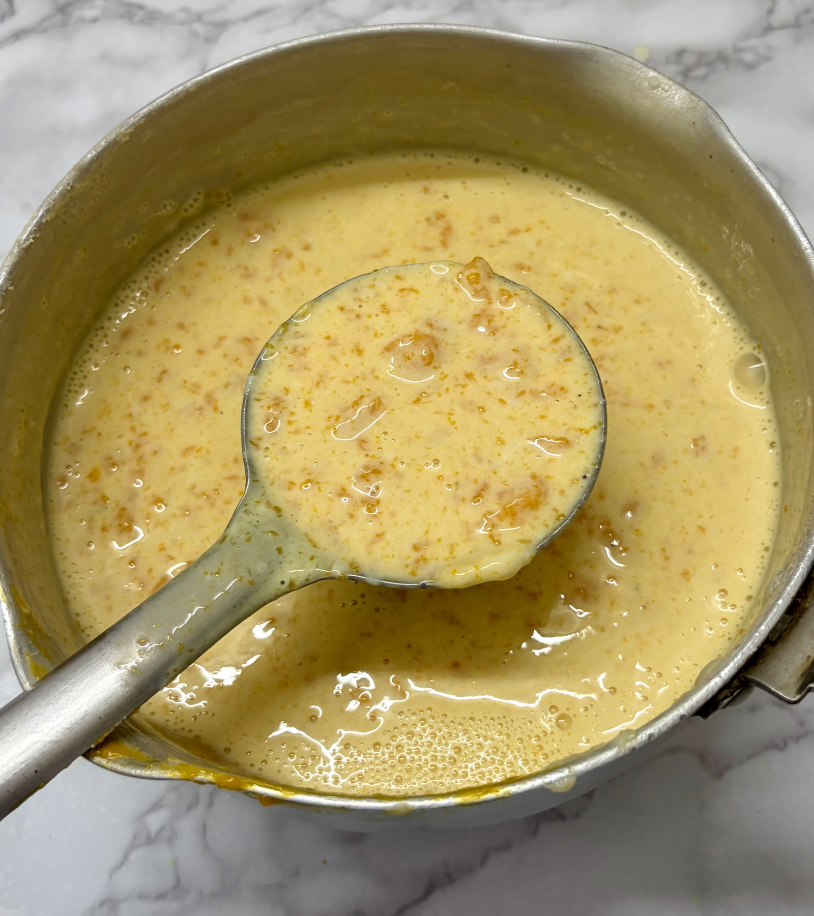 Step 2.2: Gently fold in the thick mango pulp and fresh cream (if using)