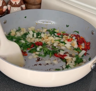 Step 2.1: Sauté onions, spinach, and smoked sundried tomatoes until softened and fragrant