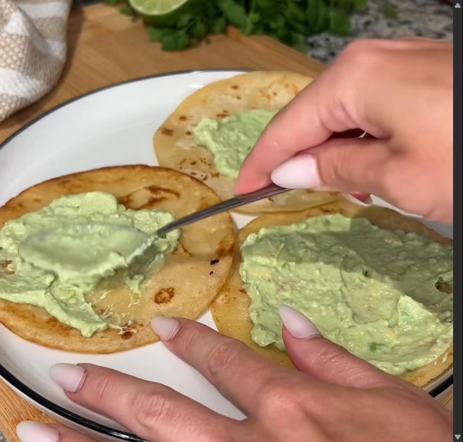 Step 4.1: Spread avocado crema onto warmed corn tortillas