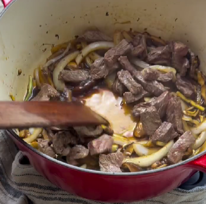 Step 1.1: Return steak to the pan, toss to coat, and finish with scallions just until wilted