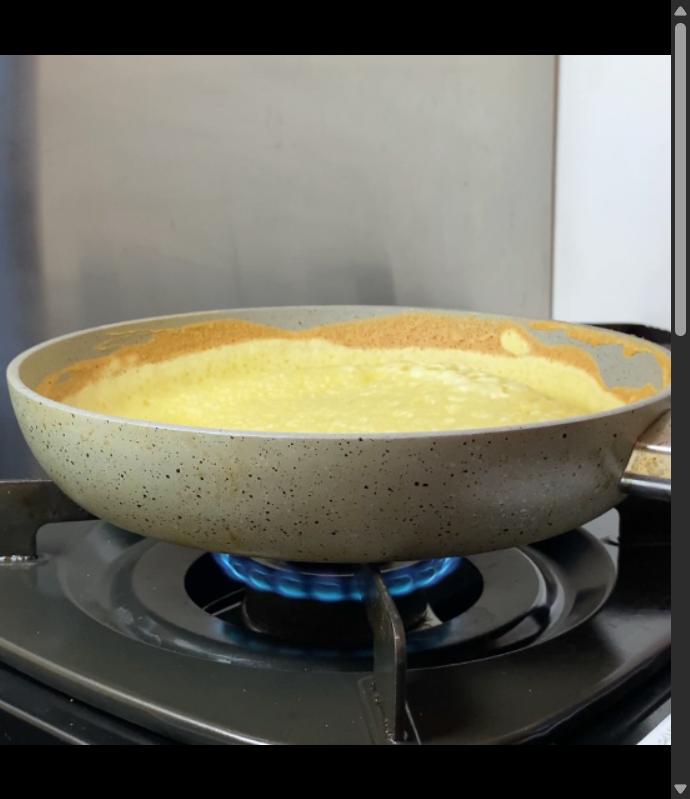 Step 2.1: Pour the batter into the hot pan, then turn the heat to medium-low, letting tiny holes pop up like a honeycomb