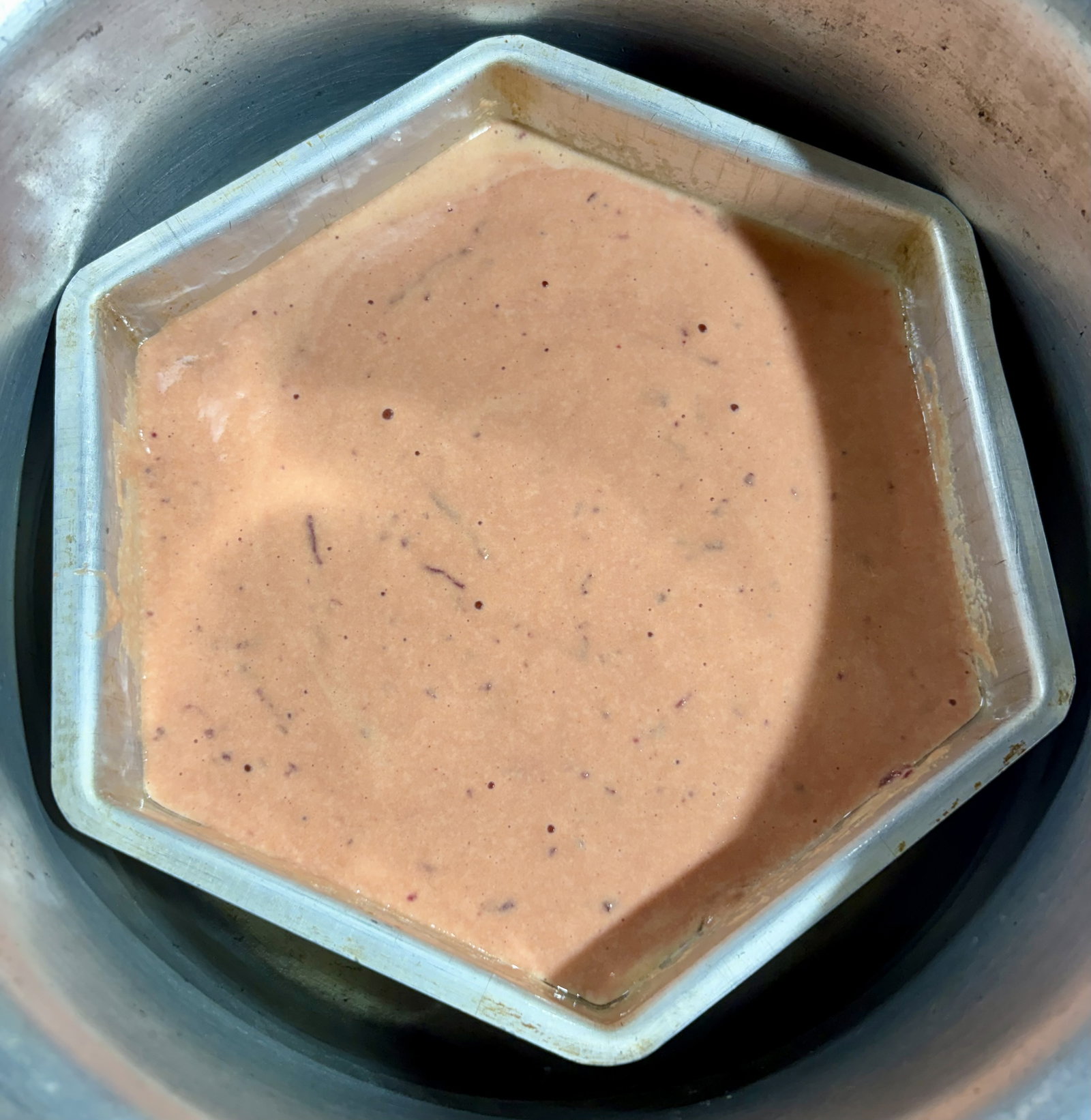 Step 3.1: Place the mould on the steamer stand, cover, and steam over medium-low heat for 20-25 minutes