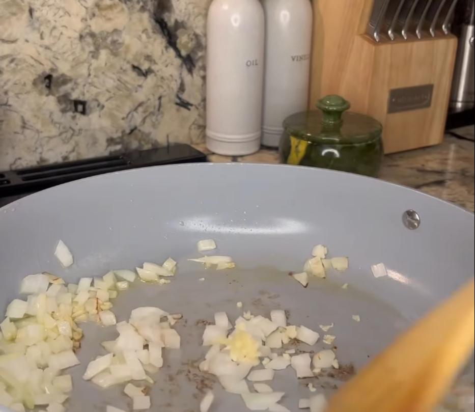 Step 1.1: Heat olive oil in a large pan and sauté onions and garlic until fragrant