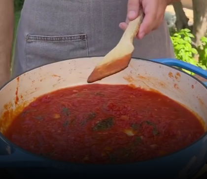Step 1.2: Add the tomatoes, basil, salt, and black pepper, then let it simmer for 5–10 minutes
