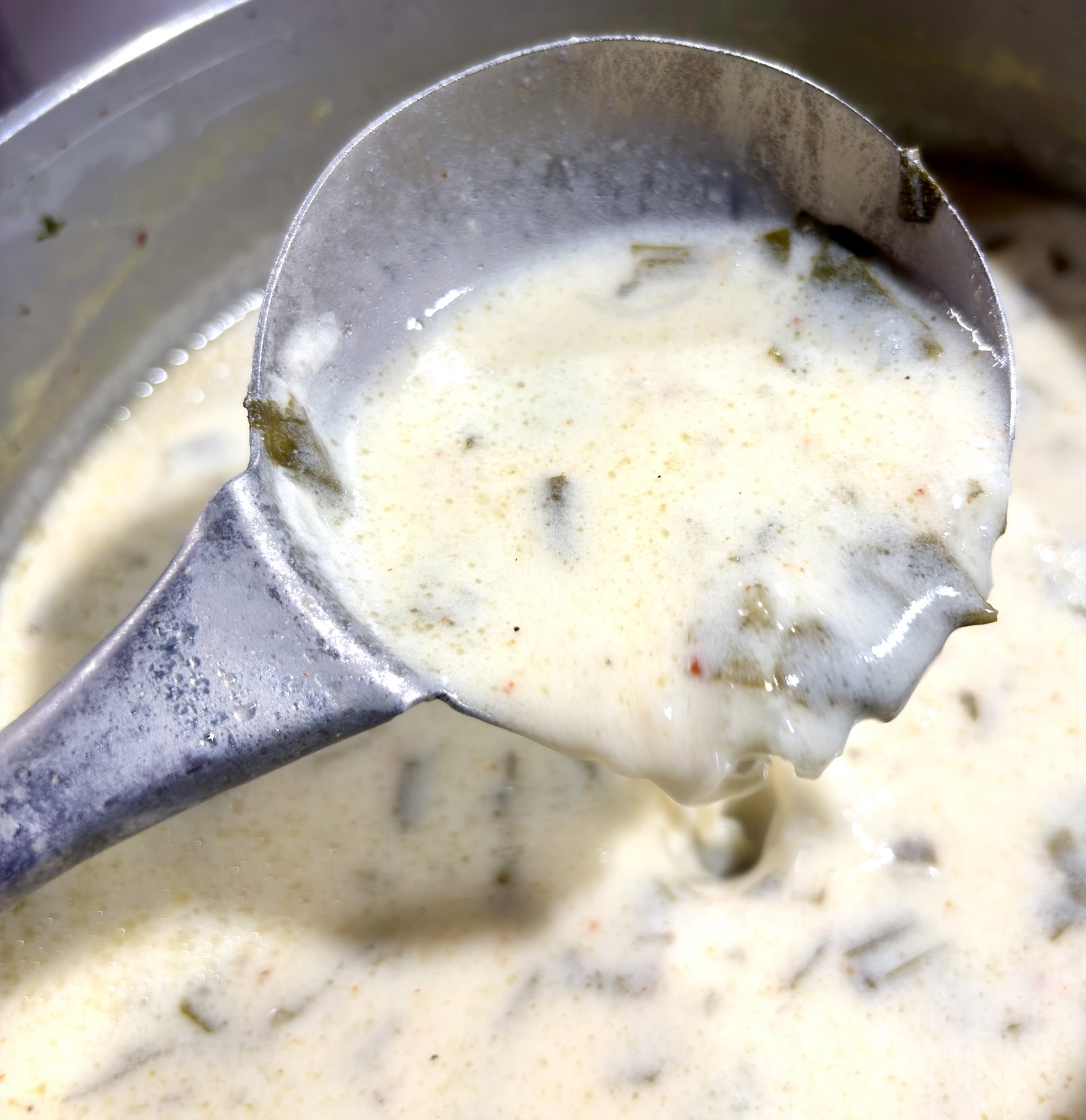 Step 2.1: Reduce the heat to low and simmer for 15-20 minutes, stirring occasionally, until the rice is completely soft and the saag reaches a smooth, semi-thick, pourable consistency