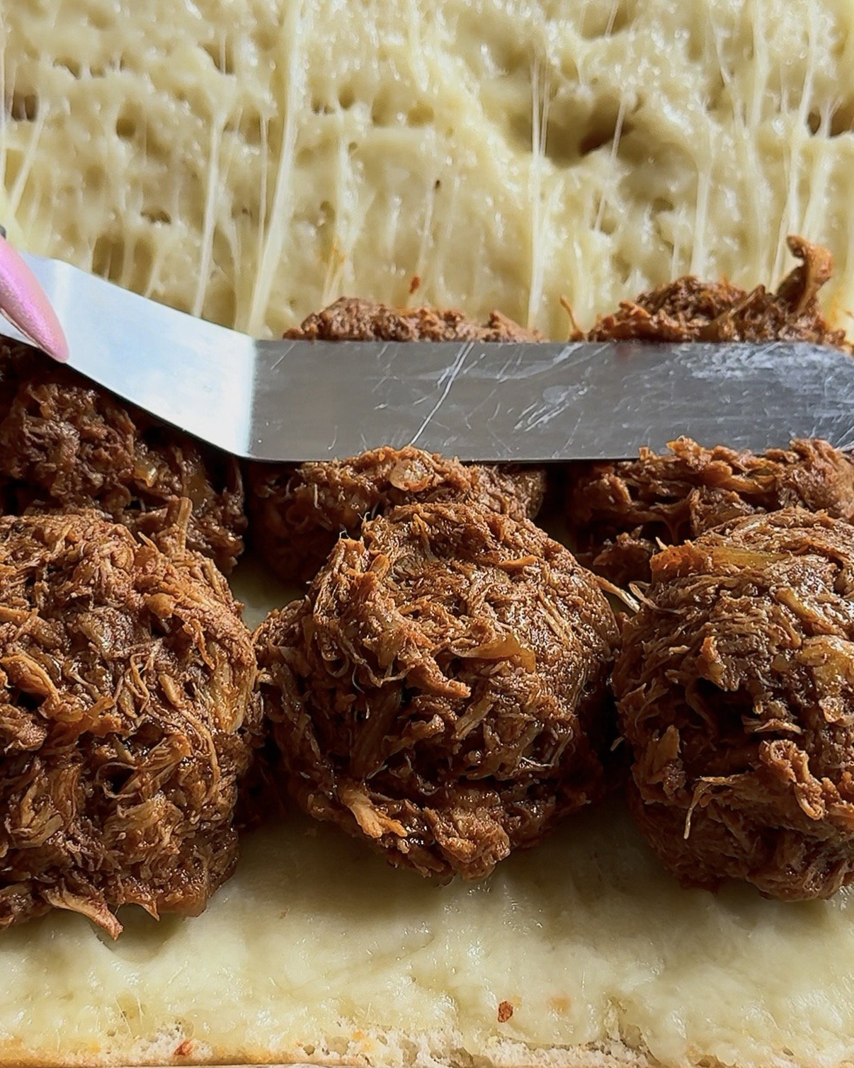 Step 4.1: Layer the pulled chicken generously on the bottom slice of the bread