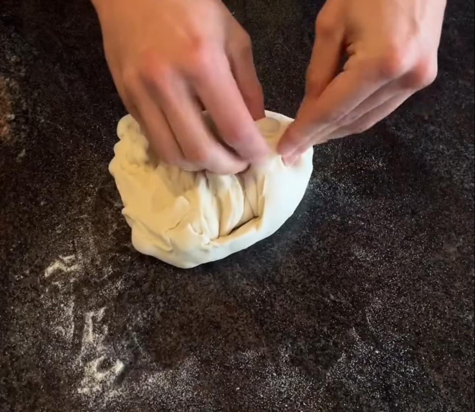 Step 1.1: Form the dough into one ball and shape it, stitching up the bottom to seal