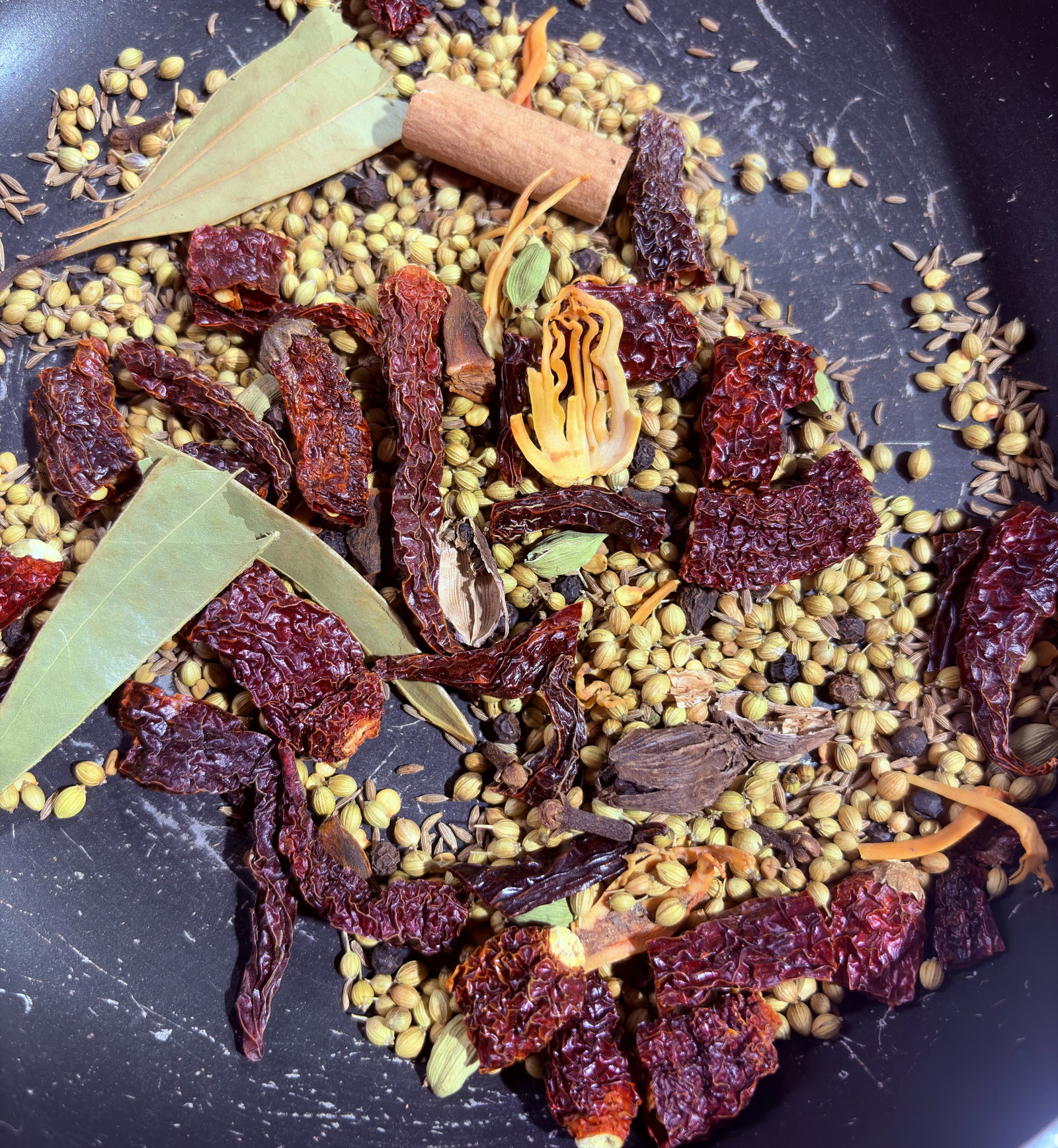 Step 1.1: Add all the whole spices except the turmeric powder