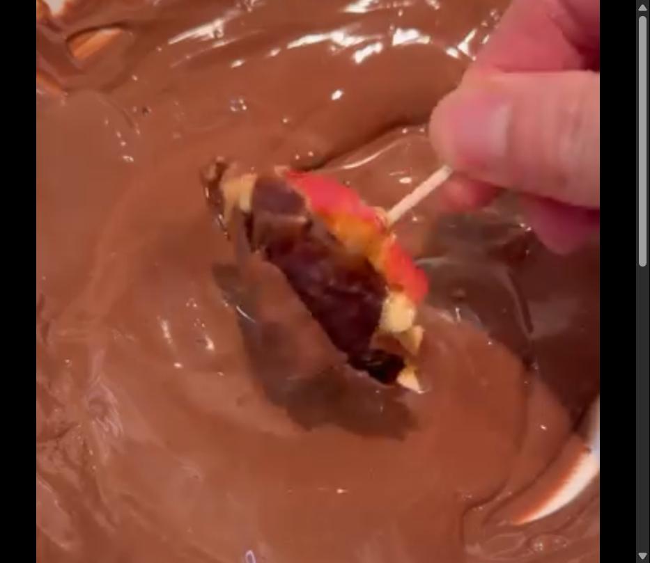 Step 1.1: Dip the bottom half of each date into the melted chocolate
