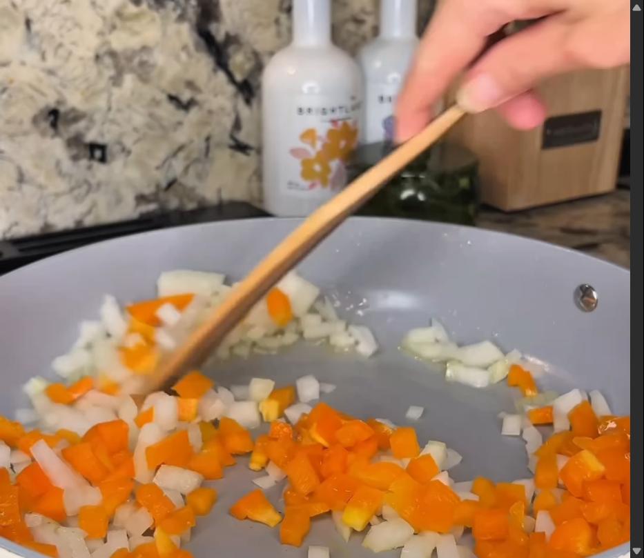 Step 2.1: Add the diced onion, bell pepper, and minced garlic to the skillet