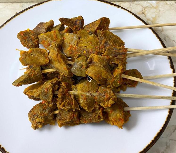 Step 5.1: Skewer 4 to 5 slices of meat onto each skewer