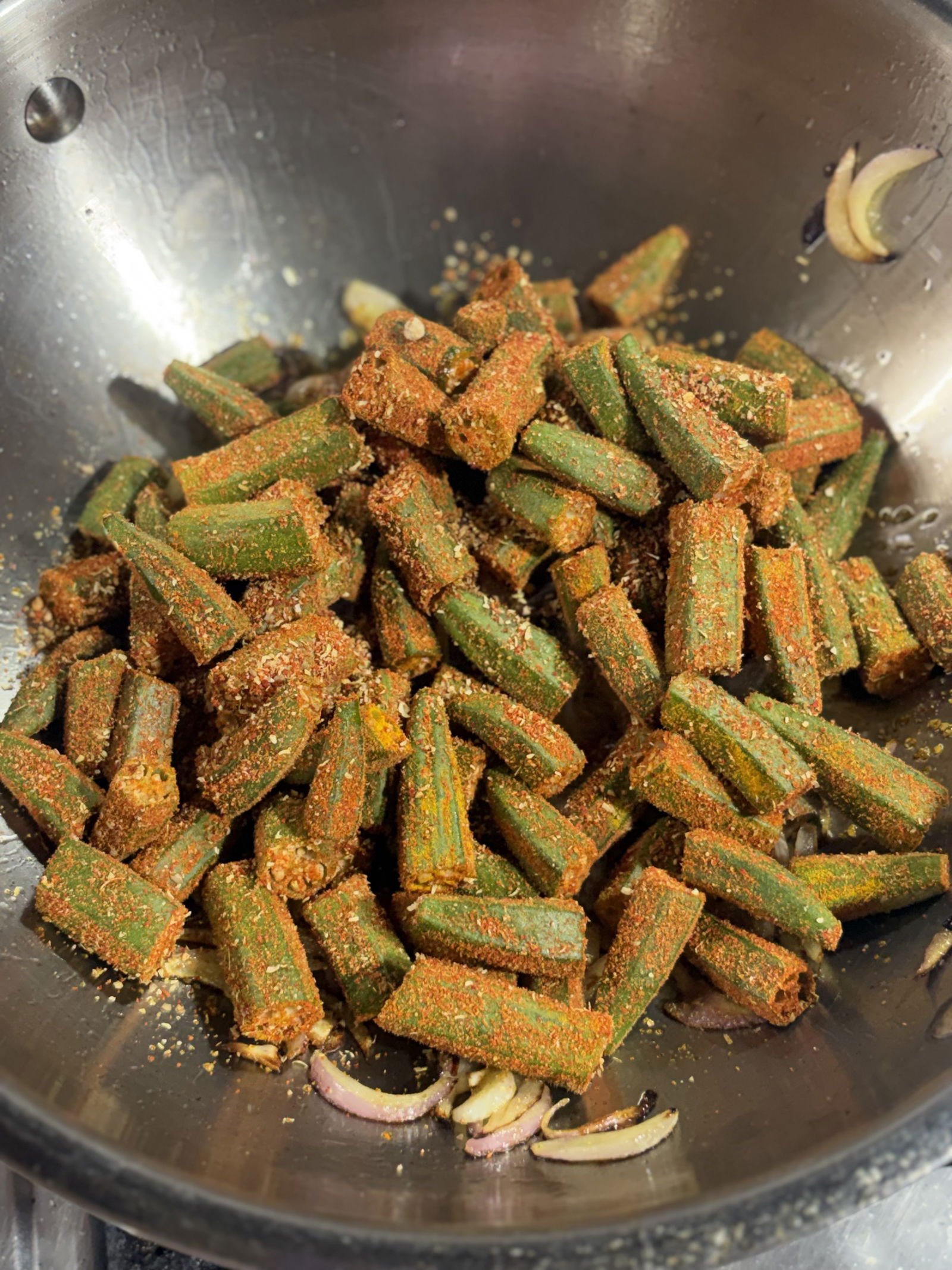 Step 4.1: Add the spiced bhindi to the pan