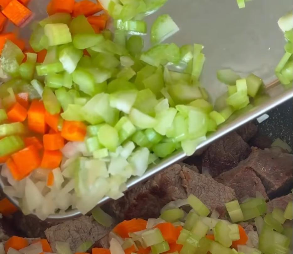 Step 1.1: Throw in the onions, carrots, and celery with a pinch of salt and fry for around 5 minutes until softened