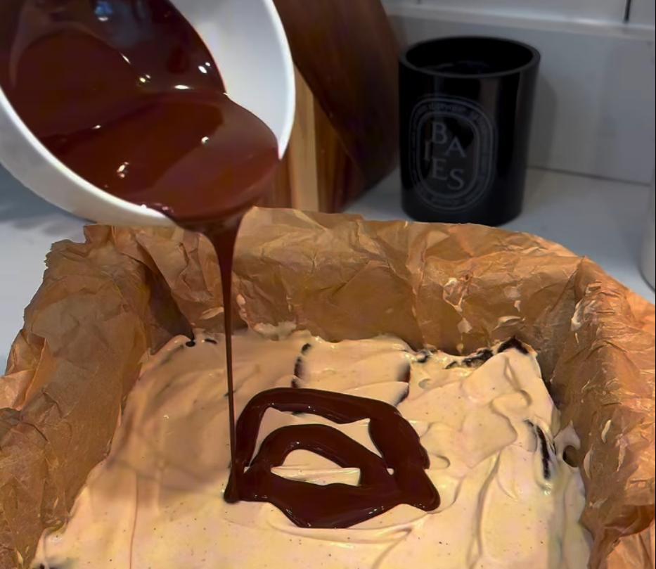 Step 1.1: Spread the melted chocolate evenly on top of the dates and yogurt layer