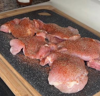 Step 1.1: Season both sides of the chicken thighs with garlic salt, onion powder, paprika, and black pepper