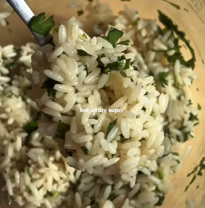 Step 2.1: Mix the hot cooked rice with chopped coriander, lime juice, olive oil, and salt in a bowl