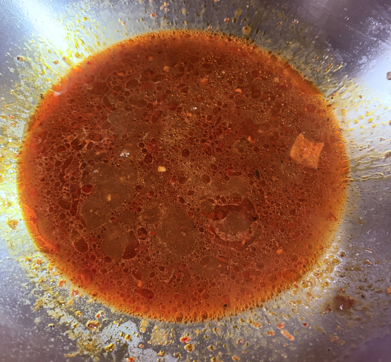 Step 3.1: Pour in water or chicken stock and bring the mixture to a gentle simmer