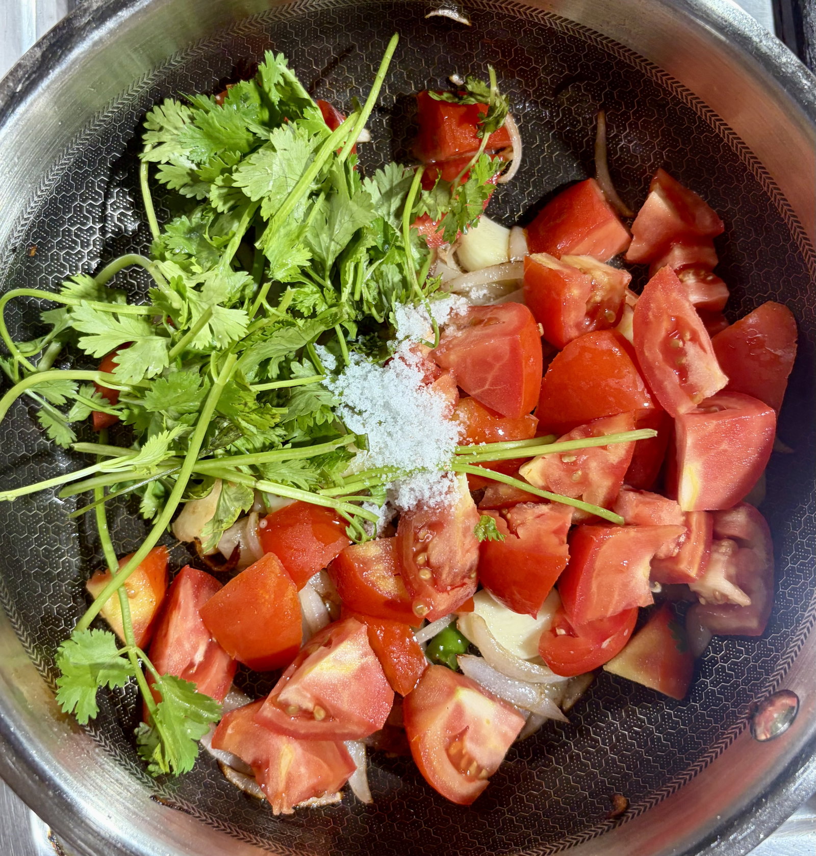 Step 1.1: Add chopped tomatoes, coriander stems/leaves, and ½ tsp salt