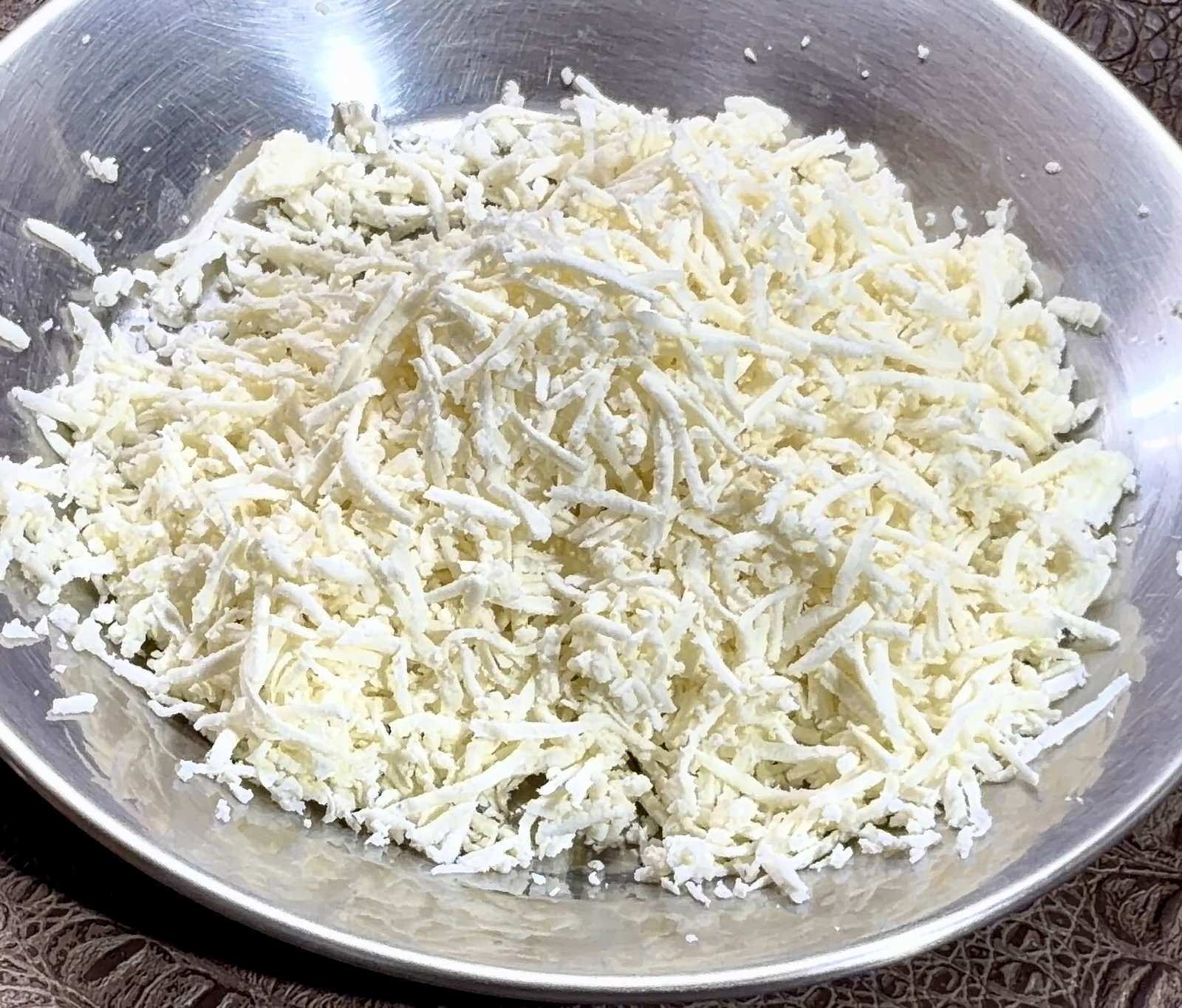Step 1.1: Grate or crumble the cottage cheese (paneer) and set it aside