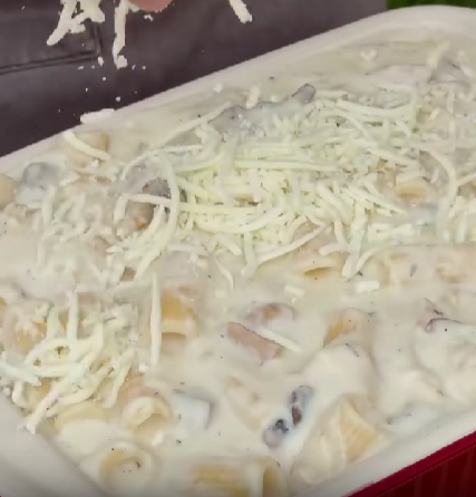 Step 3.1: Transfer the mixture to a baking dish, top with extra cheese, and broil until golden and bubbling