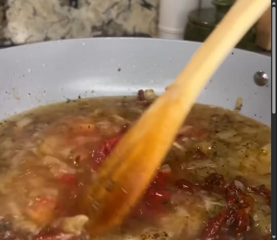 Step 1.1: Mix in tomato paste and chicken broth, bringing to a simmer and scraping brown bits from the bottom of the pan