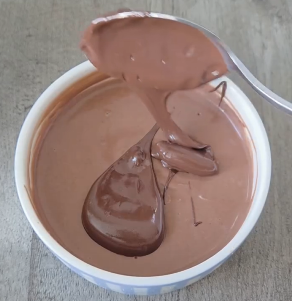 Step 1.1: Melt the chocolate chips and spread them evenly over the top of the yogurt mixture