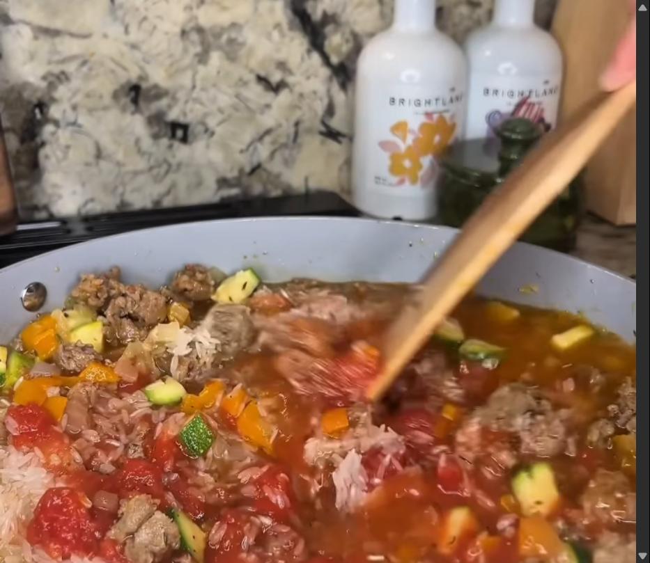 Step 3.1: Add the crushed tomatoes, rice, and chicken broth to the skillet