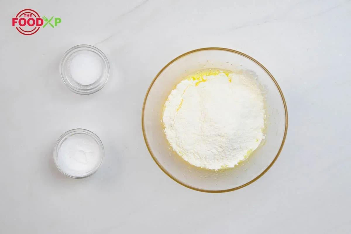 Step 1.1: Then, add 1½ tsp Baking powder and ¾ teaspoon kosher salt to the egg flour mixture