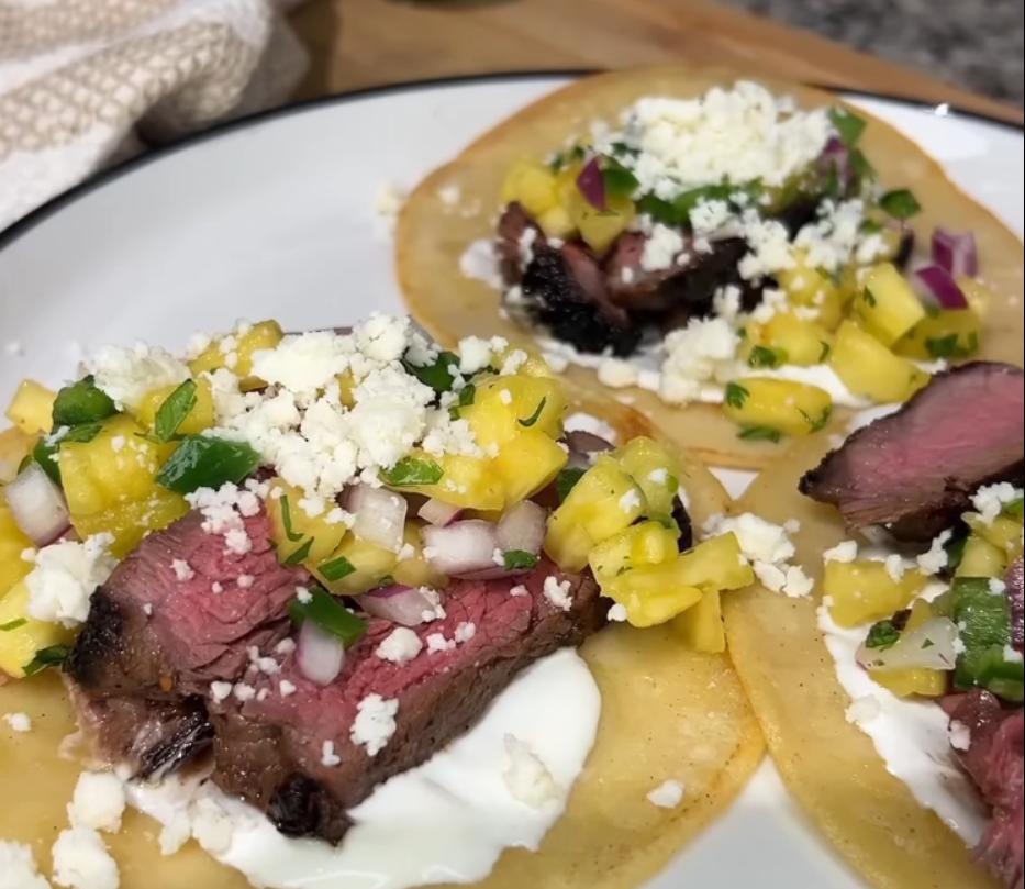 Step 6.1: Top with sliced steak, pineapple salsa, and Cotija cheese