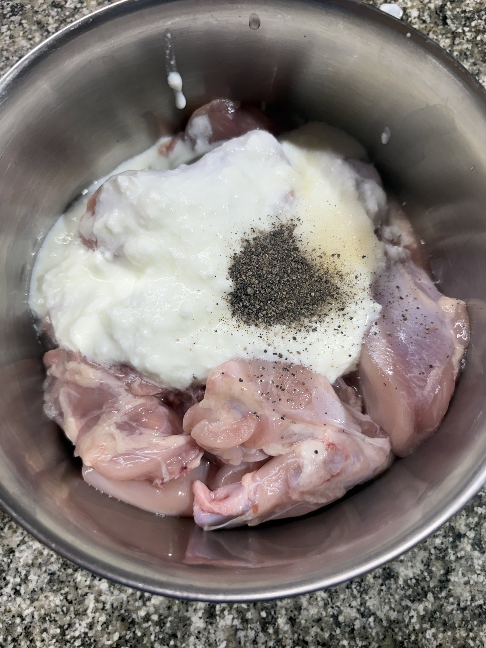 Step 1.1: In a mixing bowl, combine the chicken pieces, yogurt, salt, and black pepper