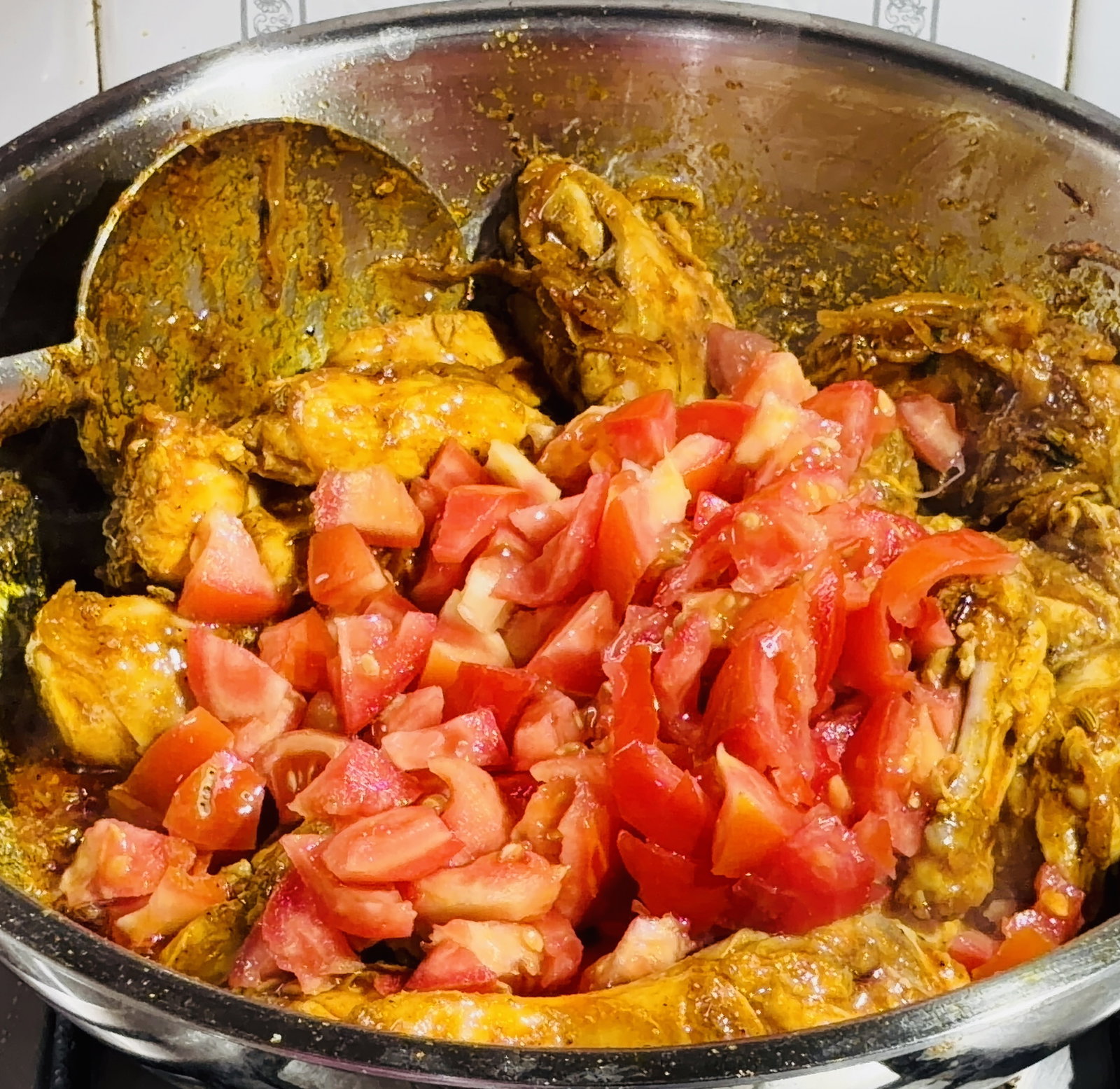 Step 4.1: Stir in the chopped tomatoes and cook until they soften