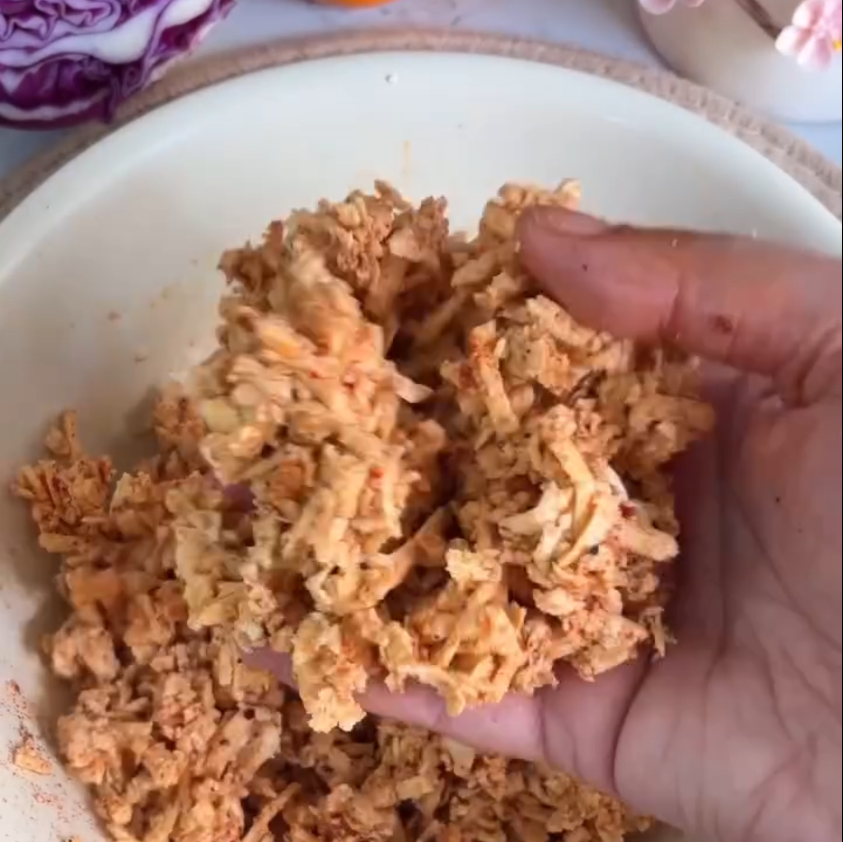 Step 2.1: Mix grated tofu with oil, salt, pepper, chilli powder, paprika, garlic powder, and soy sauce
