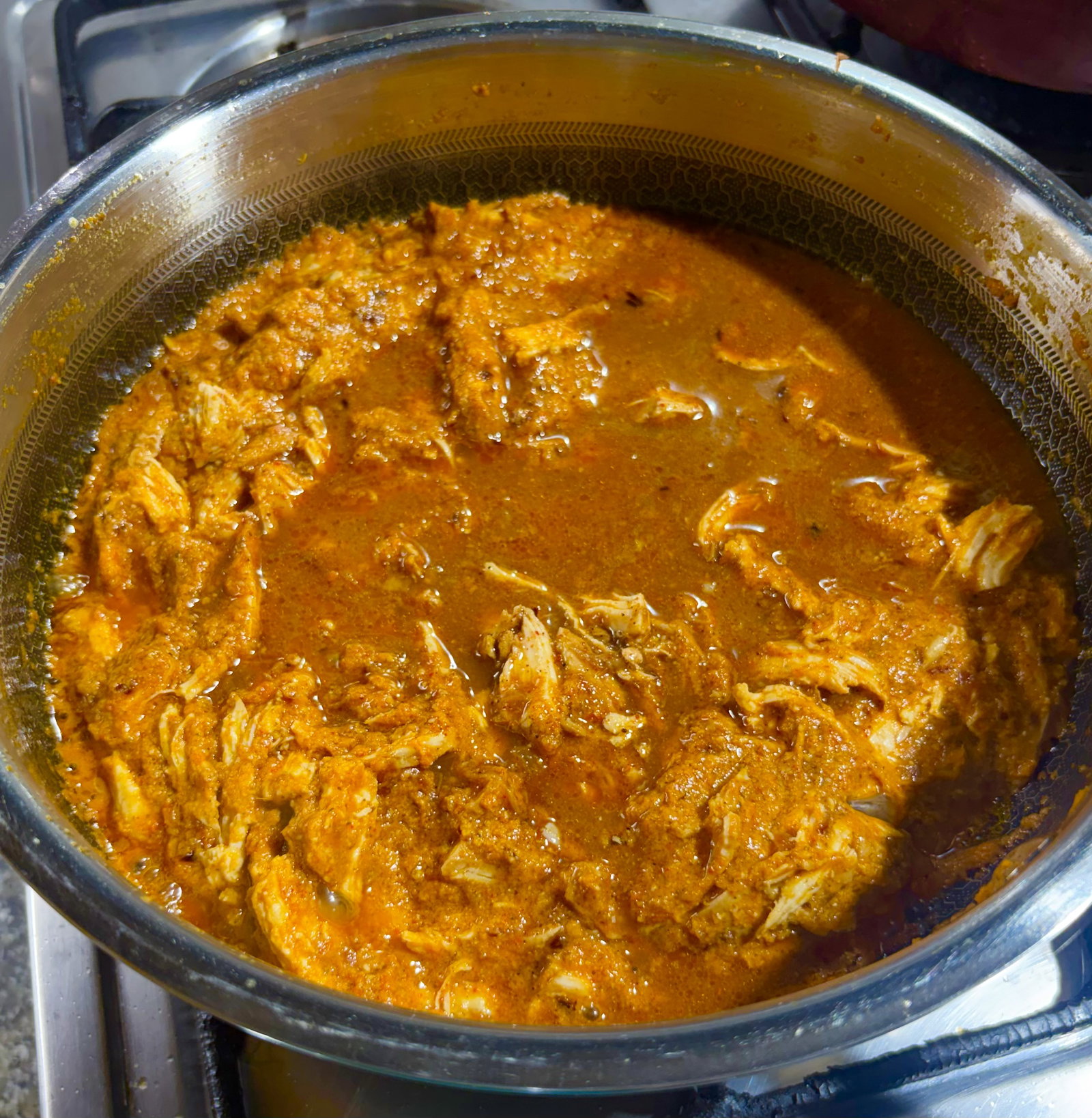 Step 4.1: Fold the shredded chicken into the gravy