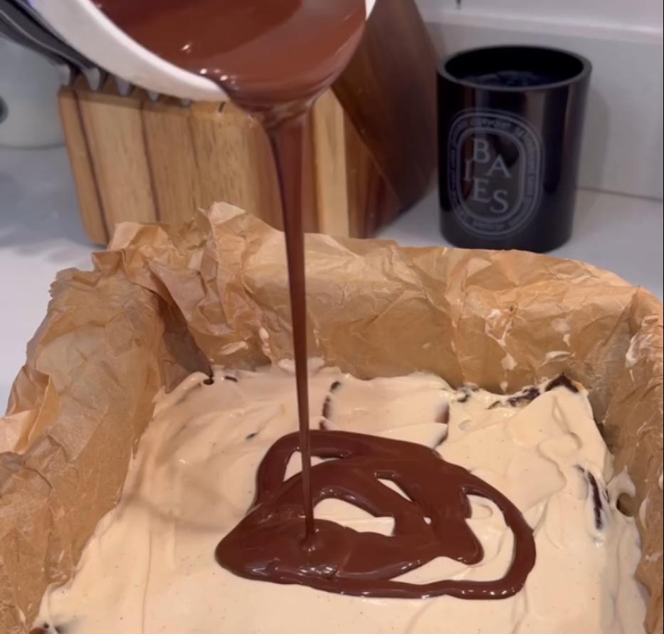 Step 1.1: Pour the melted chocolate over the yogurt and date layers, spreading it evenly