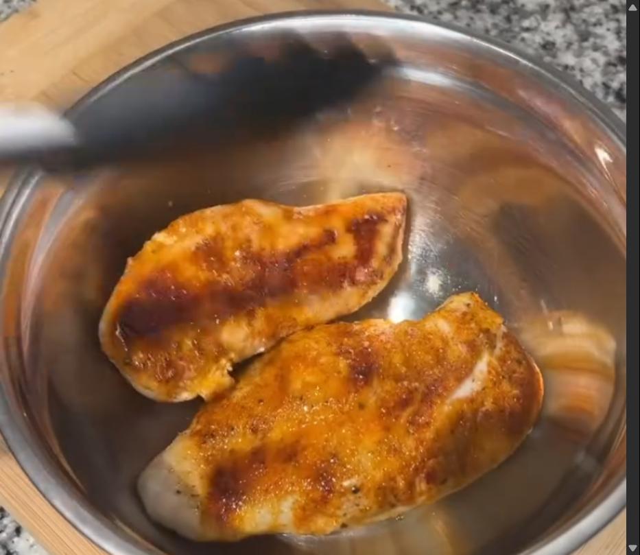 Step 2.1: Place cooked chicken breasts in a large bowl and shred using a hand mixer or 2 forks