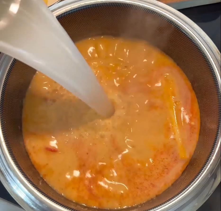 Step 1.1: Pour in the coconut milk and stock, then bring to a boil