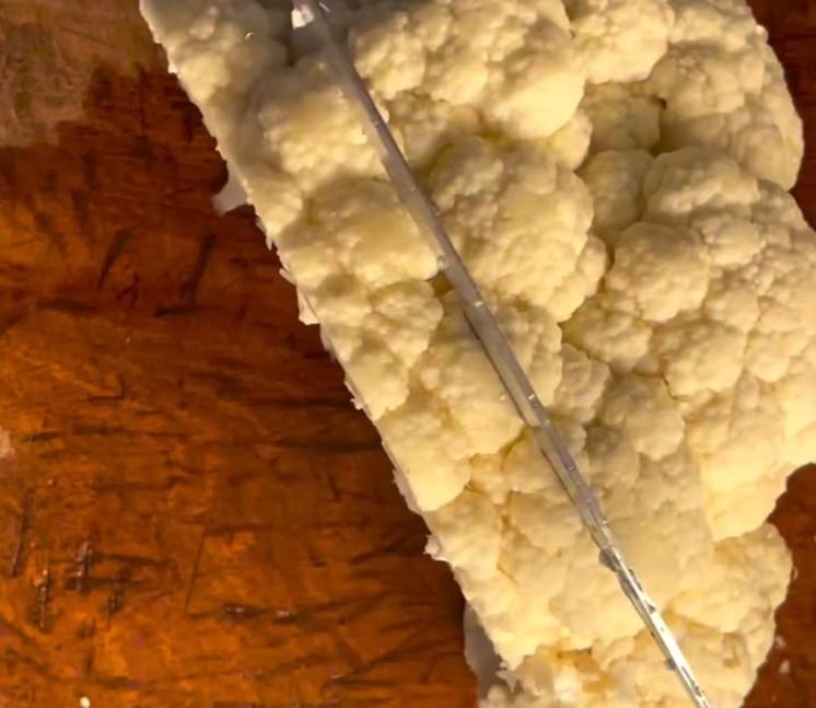 Step 1.1: Cut the cauliflower into slices about 3/4 inch thick and place on the baking sheet